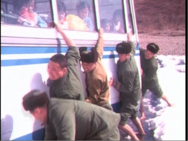 Demobilised soldiers freeing the bus from the icy river in
		'The Last Military Salute'